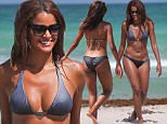 Real Housewives of Atlanta star Claudia Jordan in a triangle top bikini at the beach in Miami Beach, FL. Claudia helped a disabled man who lost his prosthetic leg in the ocean.\n\nPictured: Claudia Jordan\nRef: SPL1073784  080715  \nPicture by: Pichichi / Splash News\n\nSplash News and Pictures\nLos Angeles: 310-821-2666\nNew York: 212-619-2666\nLondon: 870-934-2666\nphotodesk@splashnews.com\n