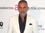 LOS ANGELES, CA - FEBRUARY 24:  Christian Audigier arrives at the 21st Annual Elton John AIDS Foundation's Oscar Viewing Party on February 24, 2013 in Los Angeles, California.  (Photo by Frederick M. Brown/Getty Images)