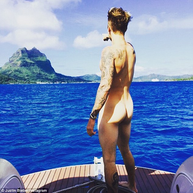 Bottoms up! Bieber caused a stir on his vacation earlier this week when he shared a nude photo of himself looking out to sea, with his butt on display for the camera