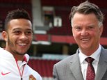 MANCHESTER, ENGLAND - JULY 10:  Memphis Depay (L) of Manchester United poses with manager Louis van Gaal ahead of a press conference to announce his signing at Old Trafford on July 10, 2015 in Manchester, England.  (Photo by Matthew Peters/Man Utd via Getty Images)
