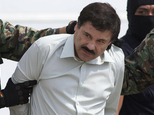 FILE - In this Feb. 22, 2014, file photo, Joaquin "El Chapo" Guzman, head of Mexico¿s Sinaloa Cartel, is escorted to a helicopter in Mexico City, following his capture overnight in the beach resort town of Mazatlan. Mexico¿s security commission said in a statement late Saturday, July 11, 2015, the top drug lord Joaquin ¿El Chapo¿ Guzman has escaped from a maximum security prison, the second time he has fled after being captured. (AP Photo/Eduardo Verdugo, File)