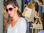 Please contact X17 before any use of these exclusive photos - x17@x17agency.com   Gisele Bundchen is spotted arriving at LAX airport solo for an outgoing flight. The supermodel and mother of two shows off her natural beauty in neutral tones and jeans. July 11, 2015/X17online.com