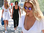 July 10, 2015: Gigi Hadid is spotted in Soho wearing a casual white summer dress while with her friend Leah McCarthy today in New York City. \nMandatory Credit: INFphoto.com Ref: infusny-293