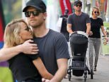 UK CLIENTS MUST CREDIT: AKM-GSI ONLY\nEXCLUSIVE: Vancouver, Canada - 'Avatar' star Sam Worthington and his beautiful wife Lara Bingle were spotted bringing their three-month old baby Rocket to sushi take-out in Vancouver on Thursday afternoon. The happy couple couldn't keep their hands off each other, staying close as Sam wrapped his arms protectively around Lara. Once the actor spotted our shutterbugs, he offered up a playful one-fingered salute behind Lara's back.\n\nPictured: Sam Worthington and Lara Bingle\nRef: SPL1077268  120715   EXCLUSIVE\nPicture by: AKM-GSI / Splash News\n\n