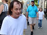 Angus Young of AC/DC and his bodyguard are mobbed by fans after a city stroll.\\n\\nFeaturing: Angus Young\\nWhere: Duesseldorf, Germany\\nWhen: 11 Jul 2015\\nCredit: WENN.com