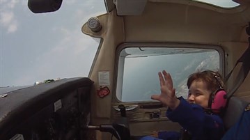 9RAW: Young girl laughs hysterically during first aerobatics flight with dad