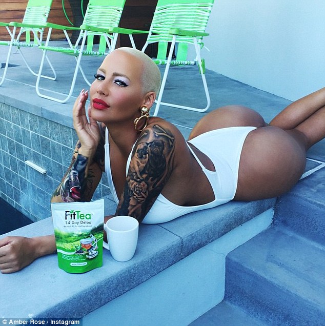 Bootilicious: Amber Rose, 31, paraded her killer body in a seriously skimpy swimsuit as she enjoyed some down time by the pool on Saturday