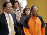 FILE - In this Tuesday, July 7, 2015 file photo, Juan Francisco Lopez-Sanchez, right, is lead into the courtroom by San Francisco Public Defender Jeff Adachi, left, and Assistant District Attorney Diana Garciaor, center, for his arraignment at the Hall of Justice in San Francisco. More than 1,800 immigrants that the federal government wanted to deport were nevertheless released from local jails and later re-arrested for various crimes, according to a government report released Monday, July 13, 2015. The controversy was re-ignited after 32-year-old Kathryn Steinle was shot to death while walking on a San Francisco pier and authorities arrested suspect Lopez-Sanchez, who was released from jail in April even though immigration officials had lodged a detainer to try to deport him from the country for a sixth time. (Michael Macor/San Francisco Chronicle via AP, Pool, File)