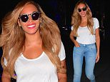 Beyonce was spotted looking smoking hot in a super casual outfit, while in NYC on Monday. The songstress was spotted leaving her office building with a huge smile on her face. She dressed down, but still looked as hot as ever. She wore a white tee, blue jeans and converse sneakers as she hit the streets in the early evening. \n\nPictured: Beyonce\nRef: SPL1076754  130715  \nPicture by: 247PAPS.TV / Splash News\n\nSplash News and Pictures\nLos Angeles: 310-821-2666\nNew York: 212-619-2666\nLondon: 870-934-2666\nphotodesk@splashnews.com\n
