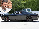 UK CLIENTS MUST CREDIT: AKM-GSI ONLY\nEXCLUSIVE: Newly single Ben Affleck emerged from the Pacific Palisades mansion he still shares with ex-wife, Jennifer Garner, driving a brand new Dodge SRT that was delivered on Tuesday. Now that the 'Batman vs. Superman' is no longer attached, it looks like he's ready to shed the married lifestyle and embrace bachelor-dom once again with a sweet new ride.\n\nPictured: Ben Affleck\nRef: SPL1079024  130715   EXCLUSIVE\nPicture by: AKM-GSI / Splash News\n\n