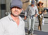 EXCLUSIVE TO INF.
June 13, 2015: Gerard Butler and girlfriend  Morgan Brown getting coffee in Los Angeles, CA.  After coffee, the couple headed straight to a waiting car.
Mandatory Credit: INFphoto.com Ref.: inf-00