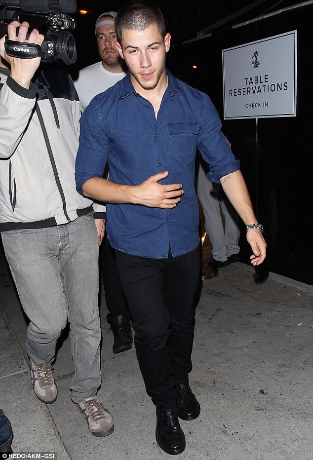 Having a gay old time: Nick Jonas, who has said he loves having a horde of homosexual fans, arriving at Bootsy Bellows in West Hollywood on Tuesday night