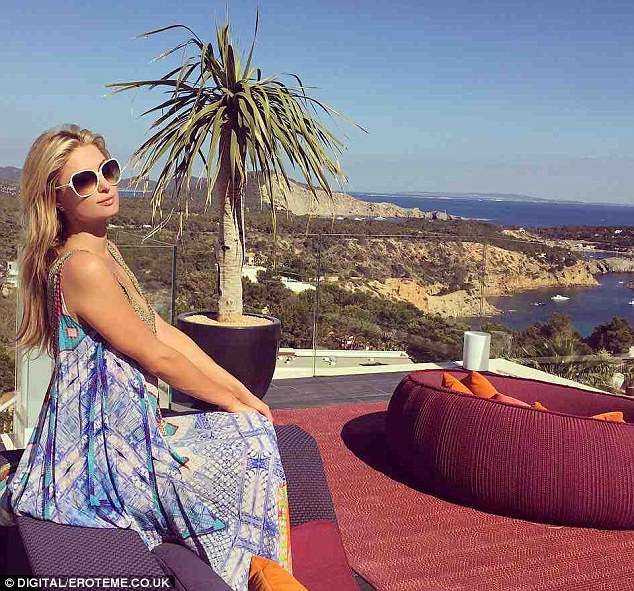 Getaway: Paris Hilton posted a photo of herself on Wednesday where she was basking in the sun in Ibiza where she is set to serve as a DJ; she noted her caption that she was with new beau Thomas Gross