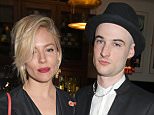 LONDON, ENGLAND - APRIL 27:  Sienna Miller (L) and Tom Sturridge attend an after party following the press night performance of "American Buffalo" at The National Cafe on April 27, 2015 in London, England.  (Photo by David M. Benett/Getty Images)