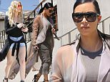 Kim Kardashian  has her game face on with a serious look in beige shirt dress heading to film reality show with her sisters at Carrara Pastries July 14, 2015 X17online.com