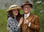 Sir John Hurt with his wife Anwen after being awarded a knighthood by Queen Elizabeth II during an Investiture ceremony at Windsor Castle. PRESS ASSOCIATION Photo. Picture date: Friday July 17, 2015. See PA story ROYAL Investiture. Photo credit should read: Steve Parsons/PA Wire