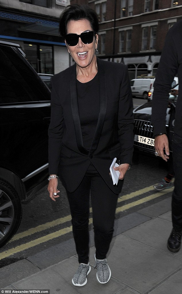 Chic: Kris added flat shoes to her smart tux-style jacket and skinny black trousers