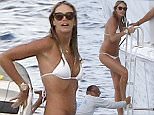 July 14th 2015 - Saint Tropez  ****** Exclusive all around Picture ******  Elle Macpherson \\'The Body\\' shows off her incredible body on a tiny sexy white bikini while trying to escape the paparazzi stationed at the back of the yacht after a morning swim, Elle returned to the boat by climbing an other access of her superyacht.  ****** BYLINE MUST READ : © Spread Pictures ******  ****** No Web Usage before agreement ******  ******Please hide the children\\'s faces prior to the publication******  ****** Stricly No Mobile Phone Application or Apps use without our Prior Agreement ******  Enquiries at photo@spreadpictures.com