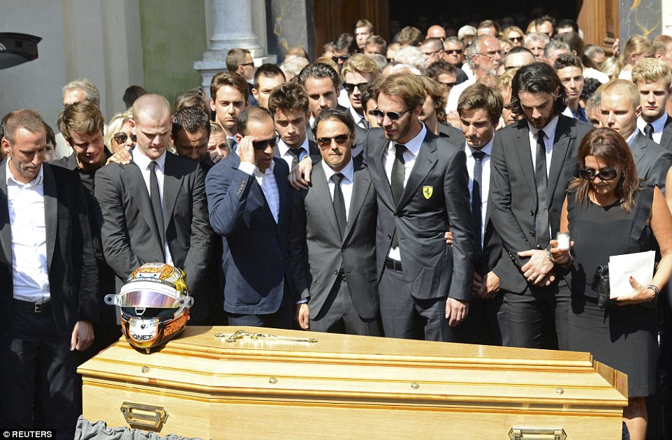 Formula One drivers Jean-Eric Vergne (fourth right) and Felipe Massa (centre) pay their wishes to Bianchi alongside other mourners