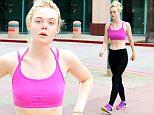 July 21, 2015: Elle Fanning shows off her toned bod in a sports bra and workout tights today in Hollywood, California today.\nMandatory Credit: Lek/INFphoto.com Ref: infusla-298