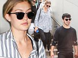 20 Jul 2015 - LOS ANGELES - USA  GIGI HADID & JOE JONAS AT LAX.   BYLINE MUST READ : XPOSUREPHOTOS.COM  ***UK CLIENTS - PICTURES CONTAINING CHILDREN PLEASE PIXELATE FACE PRIOR TO PUBLICATION ***  **UK CLIENTS MUST CALL PRIOR TO TV OR ONLINE USAGE PLEASE TELEPHONE  44 208 344 2007 ***