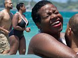 EXCLUSIVE: **PREMIUM EXCLUSIVE **Singer Fantasia Barrino was spotted getting cosy with her new husband as the two lovebirds enjoyed their romantic honeymoon in Puerto Rico. The 31-year-old former American Idol winner looked deliriously happy with beau Kendall Taylor days after tying the knot on a gleaming yacht at home in North Carolina. The loved up duo enjoyed the beach and pool at their luxury oceanfront hotel on Friday (July 24) after jetting into the island two days earlier. Fantasia showed off her famous curves in a black and white bikini, accessorized with bright red lipstick and a black floppy hat. They also spent some low key time exploring historic Old San Juan and were seen enjoying a lively drinks session at their hotel pool bar while chatting to fellow hotel guests who were eager to take selfies with the performer. Fantasia, a mother of two, hit the headlines in 2011 after having a scandalous affair with married man Antwaun Cook who later reconciled with his wife. \n\nP