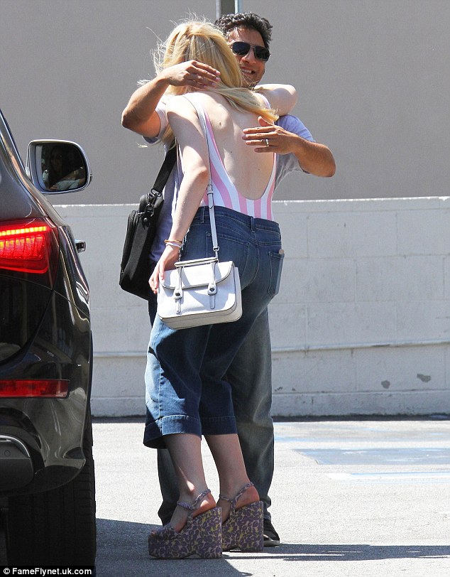 Time to say goodbye: Elle gave her friend a hug as they said goodbye following their catch up in Studio City