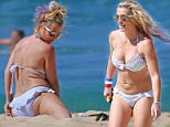 EXCLUSIVE: PREMIUM RATES APPLY A bikini clad Britney Spears shows off her flexibility stretching on the beach in Hawaii.\n\nPictured: Britney Spears\nRef: SPL1086033 240715   EXCLUSIVE\nPicture by: Splash News\n\nSplash News and Pictures\nLos Angeles:310-821-2666\nNew York:212-619-2666\nLondon:870-934-2666\nphotodesk@splashnews.com\n