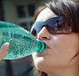 A stock photo of a Woman drinking water from a bottle