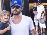 *EXCLUSIVE* Calabasas, CA - Scott Disick was seen taking his children Mason and Penelope out to dinner at their favorite local restaurant, Rosti Cafe, in Calabasas. As Scott and the children were eating dinner, two fine looking party girls walked into the restaurant, at which point Scott sat in his seat and kept interacting with his children, completely ignoring the would be distraction. Noticeably absent from the family outing, was Scott's long time partner, Kourtney Kardashian, who may have put the girls up to testing Scott's desire to be a family man, over being a party animal. Scott passed with flying colors; this time, even remembering to bring his children when he exited the restaurant.\\n\\nAKM-GSI          July 27, 2015\\n\\nTo License These Photos, Please Contact :\\n\\nSteve Ginsburg\\n(310) 505-8447\\n(323) 423-9397\\nsteve@akmgsi.com\\nsales@akmgsi.com\\n\\nor\\n\\nMaria Buda\\n(917) 242-1505\\nmbuda@akmgsi.com\\nginsburgspalyinc@gmail.com