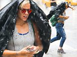 EXCLUSIVE: Lily Allen Spotted Checking For The Weather On Her iPhone While Walking Through A Major Thunderstorm While Out In New York City on Thursday afternoon Jul 30, 2015

Pictured: Lily Allen
Ref: SPL1091161  300715   EXCLUSIVE
Picture by: Felipe Ramales / Splash News

Splash News and Pictures
Los Angeles: 310-821-2666
New York: 212-619-2666
London: 870-934-2666
photodesk@splashnews.com