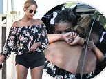 EXCLUSIVE TO INF.\nAugust 2, 2015: Beyonce enjoys a spot of retail therapy while in the Hamptons, shopping at Intermix. Sporting a black tiny short and floral top, the 33-year-old superstar carries daughter Blue Ivy as they exit ZImmerman in East Hampton, New York.\nMandatory Credit: Matt Agudo/INFphoto.com\nRef: infusny-251