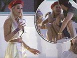 EXCLUSIVE Rita Ora gets all flirty with a mystery man as she enjoys a cigarette on a night out in Ibiza. The singer looked to be in high spirits as she draped her arm around the  guy's shoulder and even hitched her skirt up to flash a peek of her pert derriere.\n2 August 2015.\nPlease byline: Vantagenews.co.uk
