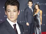 Miles Teller, left, and Keleigh Sperry attend the premiere of "Fantastic Four" at the Williamsburg Cinemas on Tuesday, Aug. 4, 2015, in the Brooklyn borough of New York. (Photo by Charles Sykes/Invision/AP)