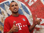 MUNICH, GERMANY - JULY 28:  Chilean midfielder Arturo Vidal poses for photographer after he signed his contract with FC Bayern Munich on July 28, 2015 in Munich, Germany.  (Photo by A. Beier/Getty Images for FC Bayern)