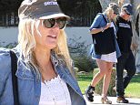 Please contact X17 before any use of these exclusive photos - x17@x17agency.com   Daryl Hannah  nursing a broken foot gets some help from her boyfriend Neil Young. The 54 year old actress and that 69 year old singer were very cozy while running errands in Malibu X17online.com