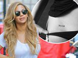 BeyoncÈ is all smiles while carrying her MacBook Pro while out and about in New York City, the singer was wearing just a white t-shirt and jeans  on Jul 13, 2015\n\nPictured: BeyoncÈ\nRef: SPL1078314  130715  \nPicture by: Felipe Ramales / Splash News\n\nSplash News and Pictures\nLos Angeles: 310-821-2666\nNew York: 212-619-2666\nLondon: 870-934-2666\nphotodesk@splashnews.com\n