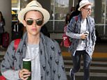 6.AUGUST.2015 - LOS ANGELES - USA\nAUSTRALIAN ACTRESS AND TATTOOED BEAUTY RUBY ROSE CARRIES A GREEN JUICE IN A JAR AS SHE ARRIVES AT LOS ANGELES INTERNATIONAL AIRPORT LAX AIRPORT WEARING A CREAM FEDORA HAT, A SKULL GREY CARDIGAN AND CARRYING A RED BACKPACK\nBYLINE MUST READ : XPOSUREPHOTOS.COM\n*AVAILABLE FOR UK SALE ONLY*\n***UK CLIENTS - PICTURES CONTAINING CHILDREN PLEASE PIXELATE FACE PRIOR TO PUBLICATION ***\n*UK CLIENTS MUST CALL PRIOR TO TV OR ONLINE USAGE PLEASE TELEPHONE 0208 344 2007*