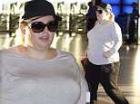 EXCLUSIVE FAO DAILY MAIL ONLINE GBP 40 PER PICTURE\n Mandatory Credit: Photo by Tania Coetzee/REX Shutterstock (4930971d)\n Rebel Wilson\n Rebel Wilson at Cape Town International Airport, South Africa - 06 Aug 2015\n Australian actress and comedian, Rebel Wilson jetted out of Cape Town Airport on Thursday evening after a whirlwind stopover to re-shoot a few scenes with Sacha Baron Cohen on their latest movie, Grimsby (aka The Curse of Hendon). Mark Strong and Isla Fisher were also in town to film additional scenes. Wislon flew into the city on her own a few days ago after rumours that she will tie the knot with new boyfriend, Mickey Gooch in Las Vegas later this year, although she denied this as media speculation on her twitter page\n