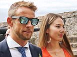 Jenson Button and his wife Jessica Michibata arrive at Castle Cornet, Guernsey for the wedding of Richard Goddard. See SWNS story SWBUTTON; Formula 1 stars came to Guernsey over the weekend, believed to be celebrating the marriage of Jenson Buttonís manager, Richard Goddard. Button and David Coulthard were two that were seen walking through Castle Cornet, thought to be the location for the occasion. It was also reported that former F1 driver Paul di Resta and former team principal Ross Brawn were present. Some members of the public who were in the castle at the time took photographs and watched the celebrities walk past. Goddard is from Guernsey and Button lived in the island from 2010 to 2012.