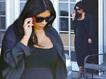 Kim Kardashian looking fantastic in all black leaving the studio