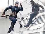 BERLIN, GERMANY - AUGUST 12:  A stuntman dressed as Captain America is seen during filming on the set of Captain America, Civil War on August 12, 2015 in Berlin, Germany.  (Photo by Chad Buchanan/GC Images)