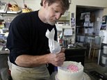 FILE  - In this March 10, 2014 file photo, Masterpiece Cakeshop owner Jack Phillips decorates a cake inside his store, in Lakewood, Colo. Phillips a suburban Denver baker who wouldnít make a wedding cake for a same-sex couple cannot cite his religious beliefs in refusing them service because it would lead to discrimination, the Colorado Court of Appeals ruled Thursday, Aug. 13, 2015. (AP Photo/Brennan Linsley, File)