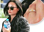 EXCLUSIVE: Demi Lovato continues to spark engagement rumors as she arrives in Los Angeles with a ring her left hand's ring finger.  The adorable singer, songwriter & actress was seen arriving into LAX from Sydney, Australia with carrying a bottle of water.\n\nPictured: Demi Lovato\nRef: SPL1100661  120815   EXCLUSIVE\nPicture by: Sharky / Splash News\n\nSplash News and Pictures\nLos Angeles: 310-821-2666\nNew York: 212-619-2666\nLondon: 870-934-2666\nphotodesk@splashnews.com\n