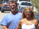 Brentwood, CA - Goldie Hawn and Kurt Russell check out the progression of their homes construction in Brentwood, California. Kurt looked clean cut and fresh shaven, unlike what we are used to seeing the star as of lately wearing long hair and a bushy mustache, as walked along side his lovely wife Goldie shielding her from a car backing up.
 
 AKM-GSI    August 11, 2015
 
To License These Photos, Please Contact :
Steve Ginsburg
(310) 505-8447
(323) 423-9397
steve@akmgsi.com
sales@akmgsi.com
or
Maria Buda
(917) 242-1505
mbuda@akmgsi.com
ginsburgspalyinc@gmail.com