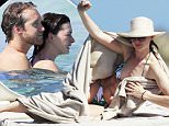 Us actress Anne Hathaway and husband Adam Shulman enjoy a day by the sea in Formentera as guests on board of Valentino's yacht.\n\nPictured:  Anne Hathaway, Adam Shulman \nRef: SPL1100836  120815  \nPicture by: Splash News\n\nSplash News and Pictures\nLos Angeles: 310-821-2666\nNew York: 212-619-2666\nLondon: 870-934-2666\nphotodesk@splashnews.com\n