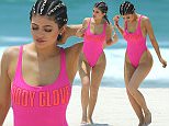 Kylie Jenner wears a hot pink swimsuit while walking on Casa Aramara beach in Mexico\nMANDITORY MENTION OF "CASA ARAMARA"