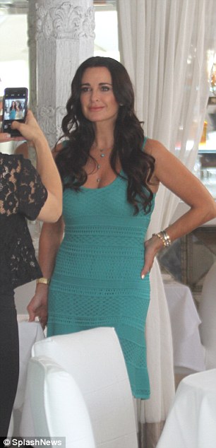 Say cheese: Kyle posed for a snap in her turquoise frock