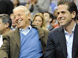 President Barack Obama, left, Vice President Joe Biden, center, and Hunter Biden share a laugh during the first half of the NCAA basketball game between Georgetown and Duke at the Verizon Center in Washington, D.C., Saturday January 30, 2010. Georgetown defeated Duke, 89-77. (Chuck Myers/MCT)
