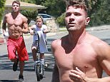 Picture Shows: Ryan Phillippe  August 29, 2015\n \n **Min Web / Online Fee £400 for set **\n \n Actor Ryan Phillippe and his son Deacon spotted out for a jog in Beverly Hills, California. While Ryan jogged, Deacon rode a motorized scooter.\n \n Exclusive  All Rounder\n UK RIGHTS ONLY\n \n Pictures by : FameFlynet UK © 2015\n Tel : +44 (0)20 3551 5049\n Email : info@fameflynet.uk.com